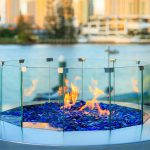 Gas round Australian fire pit with blue glass pebbles