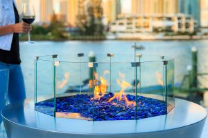 Gas round Australian fire pit with blue glass pebbles