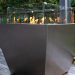 Square stainless gas fire pit with black pebbles made in Australia