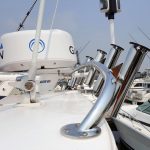 Custom stainless steel rod holder rack on Riviera boat roof