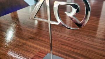 Water jet cut and laser etched stainless for Riviera's 40 years of evolution awards